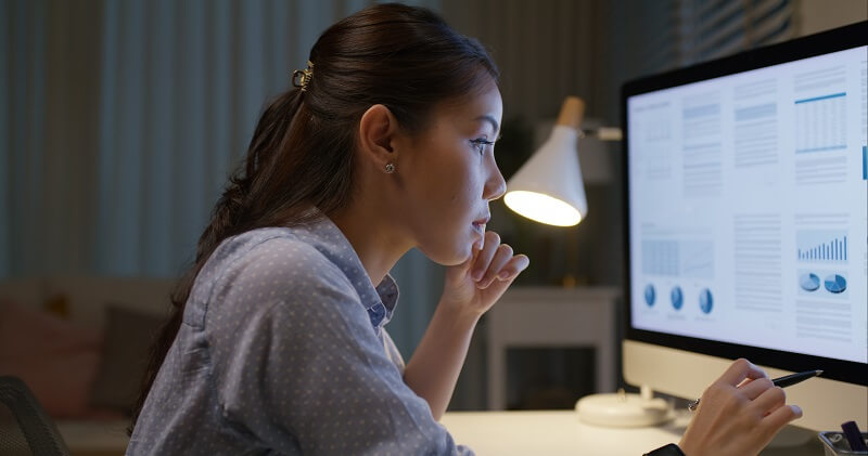 Market Research Analyst reviewing a dashboard