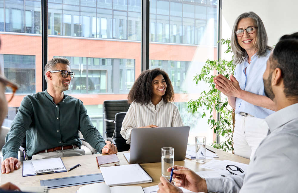 A business leader sharing insights with her team