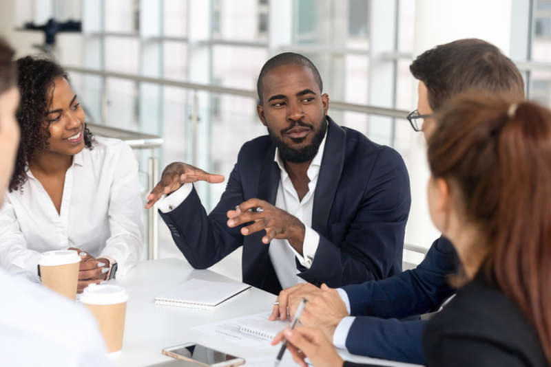 a business leader explaining strategy to his colleagues