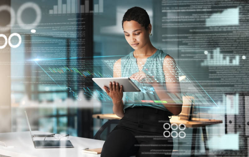 A business woman performing advanced analytics on a tablet